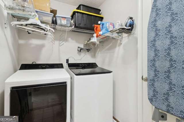 washroom with washing machine and clothes dryer