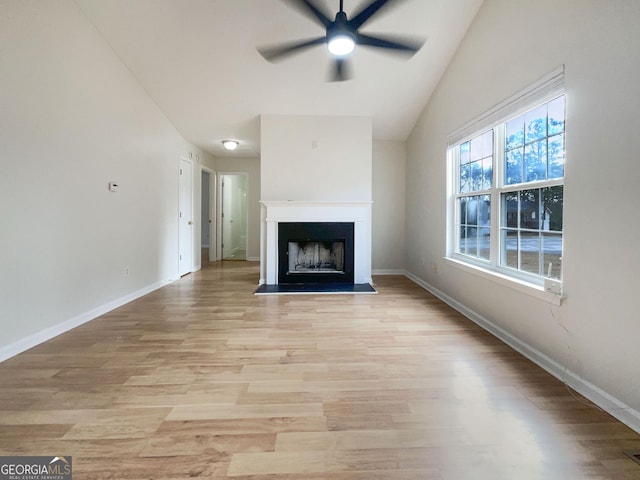 unfurnished living room featuring light hardwood / wood-style flooring and ceiling fan