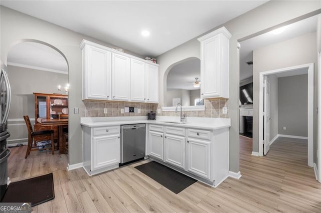 kitchen with white cabinetry, dishwasher, and sink