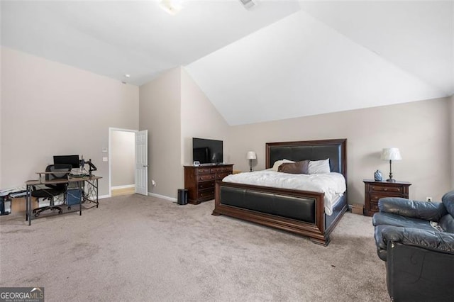 carpeted bedroom featuring lofted ceiling