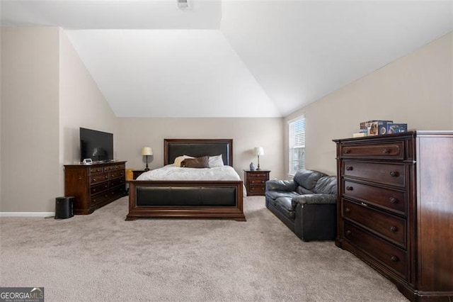 carpeted bedroom with vaulted ceiling