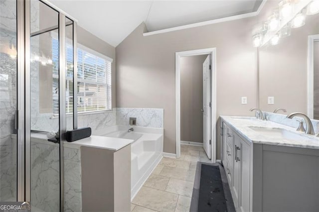 bathroom featuring vanity, lofted ceiling, and shower with separate bathtub