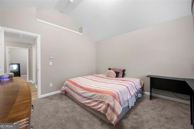 carpeted bedroom with vaulted ceiling