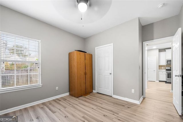 unfurnished bedroom with light wood-type flooring