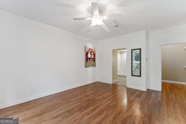 unfurnished room with hardwood / wood-style flooring and ceiling fan