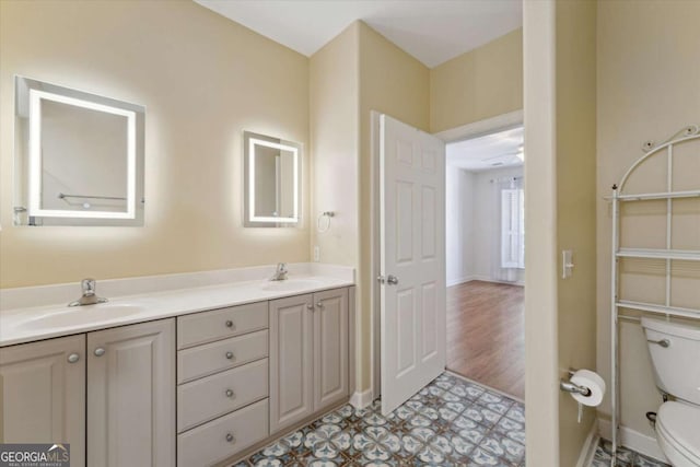 bathroom with vanity and toilet