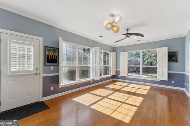 interior space featuring crown molding, ceiling fan, and hardwood / wood-style floors