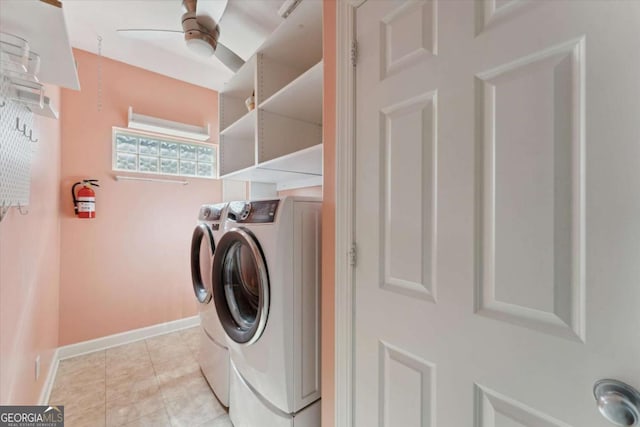 washroom with light tile patterned flooring, ceiling fan, and washer and dryer