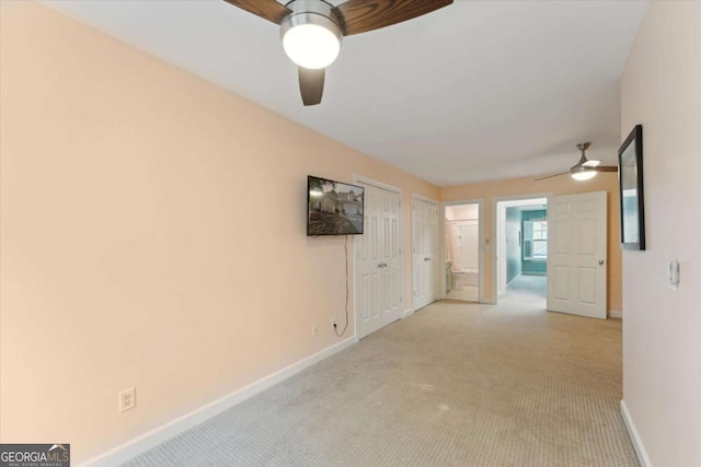 carpeted empty room with ceiling fan