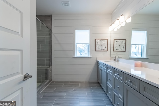 bathroom featuring vanity and walk in shower