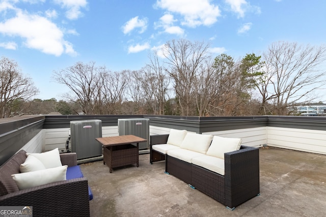 view of patio / terrace with central AC unit, outdoor lounge area, and a balcony