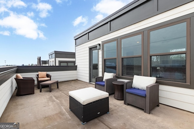 view of patio featuring a balcony