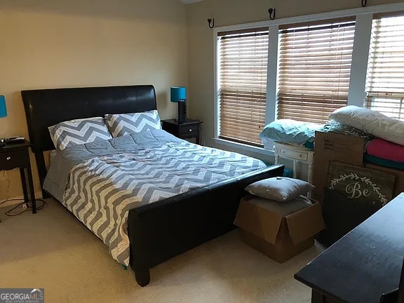 bedroom with light colored carpet