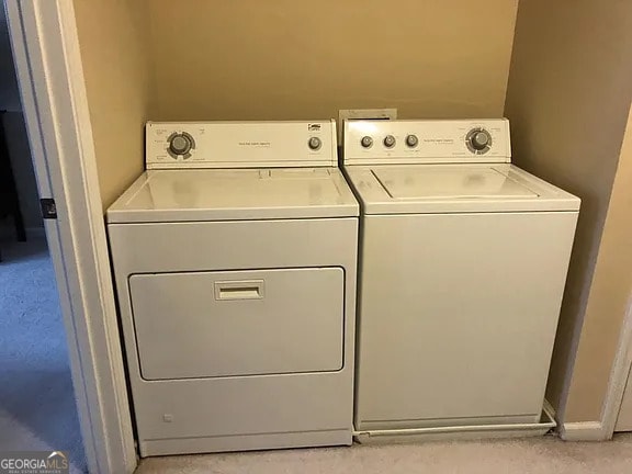 washroom featuring washer and dryer