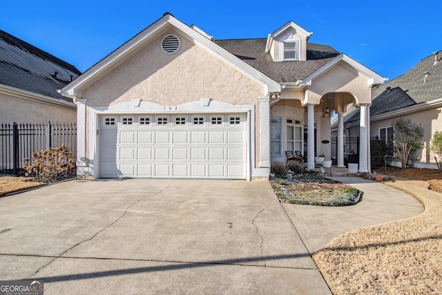 view of front of property featuring a garage