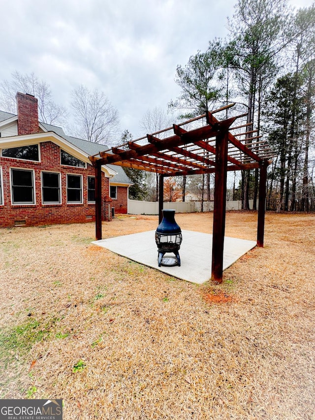 view of yard with a pergola and a patio area