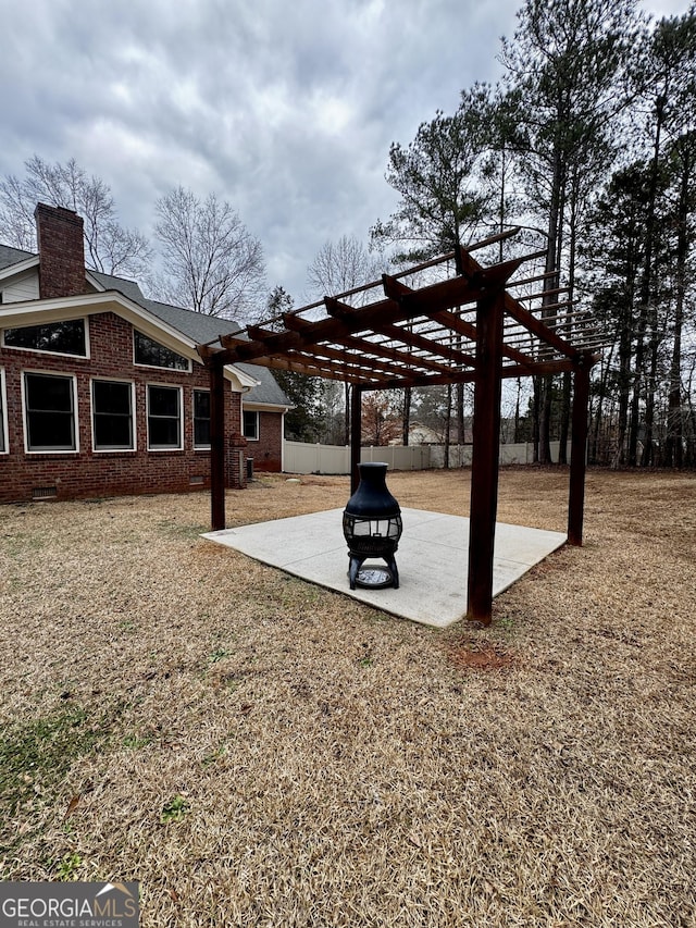 view of yard with a pergola and a patio