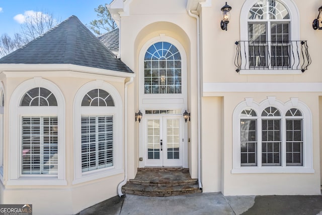 view of exterior entry featuring french doors