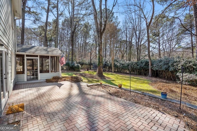 view of patio / terrace with a sunroom