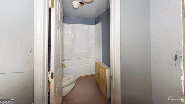 bathroom with shower / bathtub combination and toilet