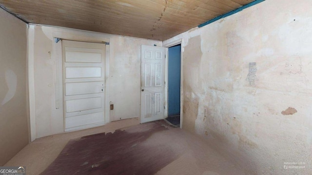 spare room featuring wood ceiling