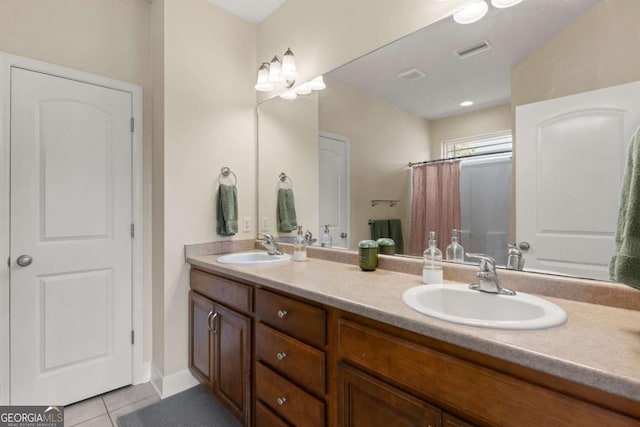 bathroom with tile patterned flooring and vanity