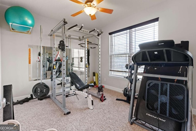 workout area featuring ceiling fan and carpet