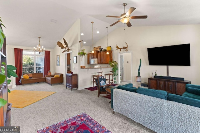 carpeted living room with ceiling fan with notable chandelier and high vaulted ceiling