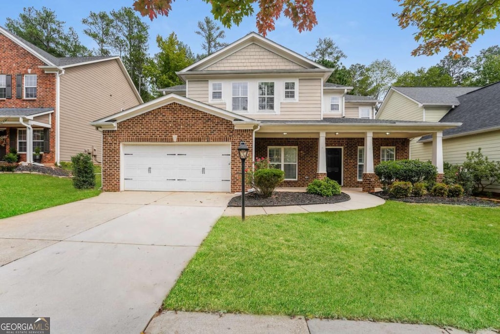 craftsman-style house with a garage, a front lawn, and covered porch