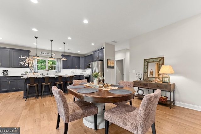 dining room featuring light hardwood / wood-style flooring