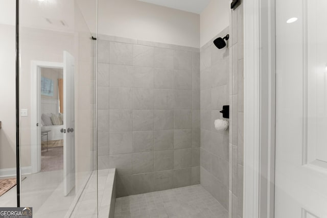 bathroom with tiled shower