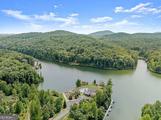 aerial view featuring a water and mountain view