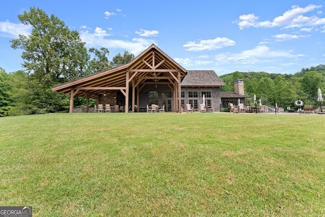 view of home's community with a yard