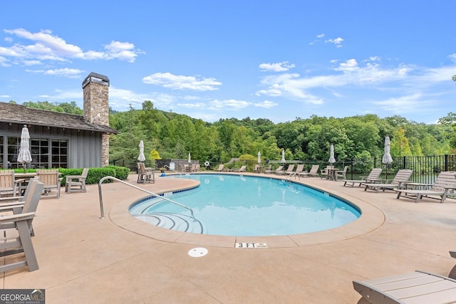 view of pool featuring a patio