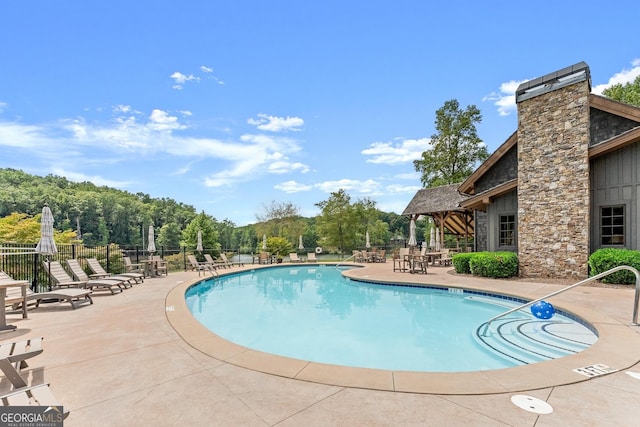 view of pool featuring a patio