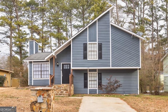6300 Creekford Dr, Lithonia, GA 30058 - view of front of home with a chimney