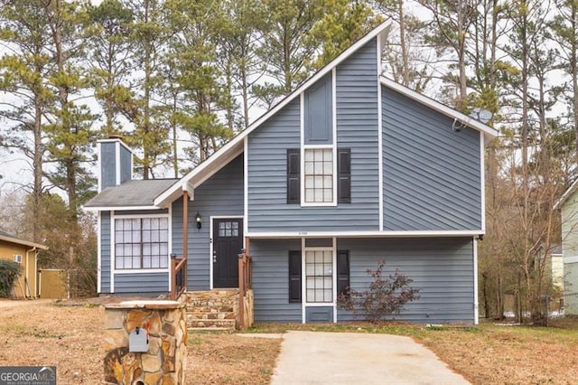 view of front of home with a chimney