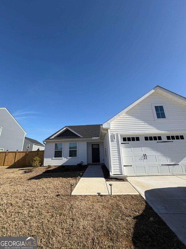 ranch-style home featuring a garage