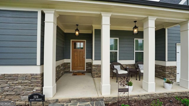 doorway to property featuring a porch