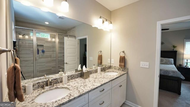 bathroom featuring vanity and an enclosed shower