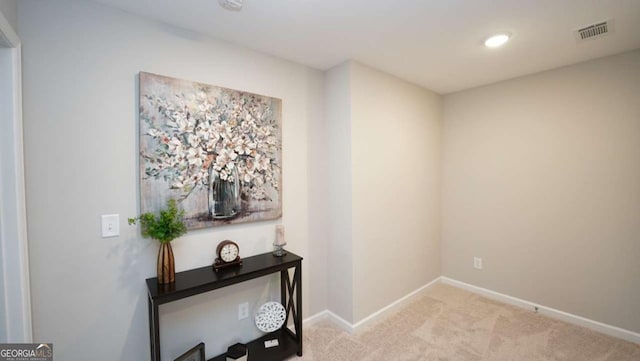 hallway with light carpet