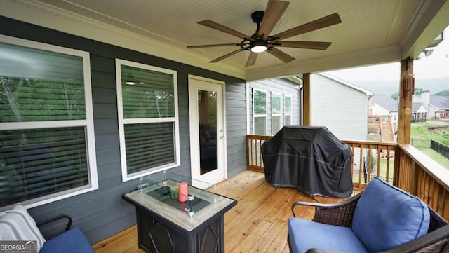 deck featuring ceiling fan and area for grilling