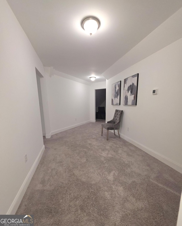 unfurnished room featuring carpet flooring