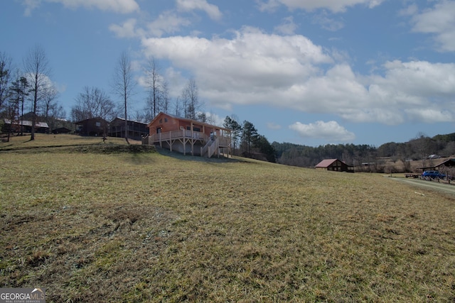 view of yard with a wooden deck