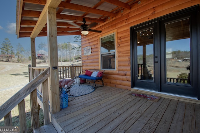 wooden terrace featuring ceiling fan