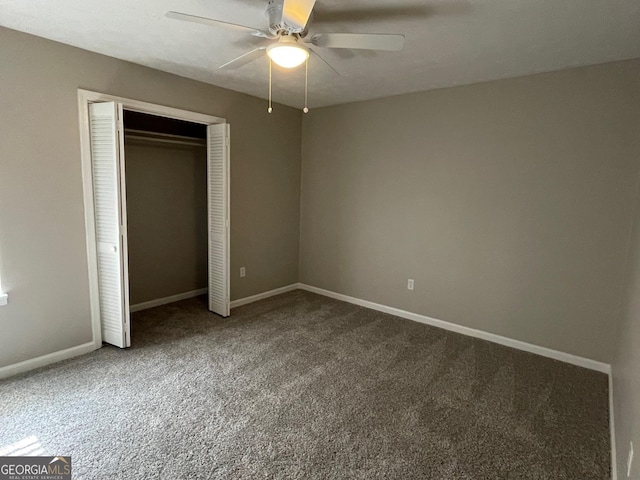 unfurnished bedroom featuring ceiling fan, a closet, and carpet