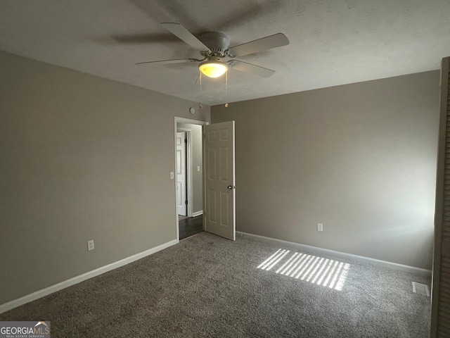 unfurnished bedroom with carpet flooring and ceiling fan