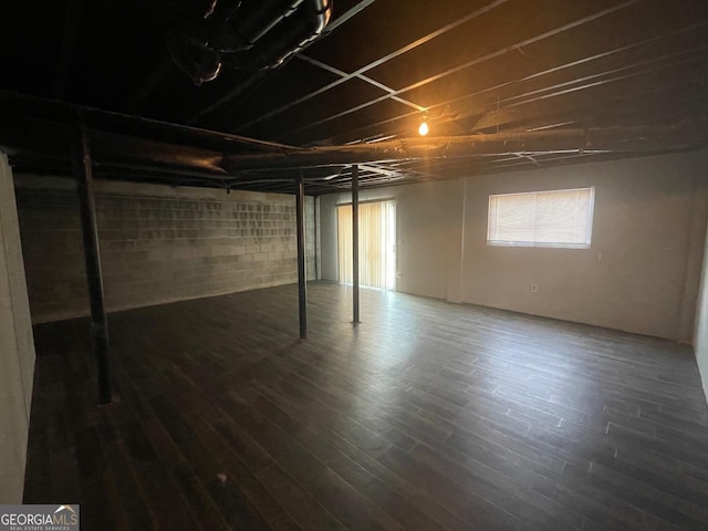 basement with dark wood-type flooring