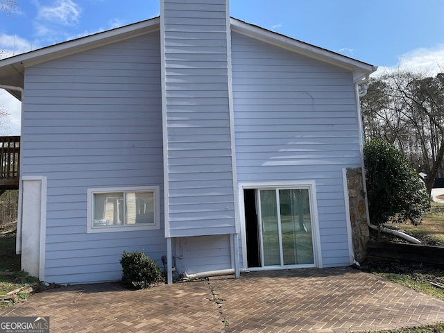 rear view of house featuring a patio