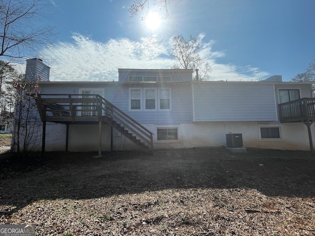 back of property featuring cooling unit